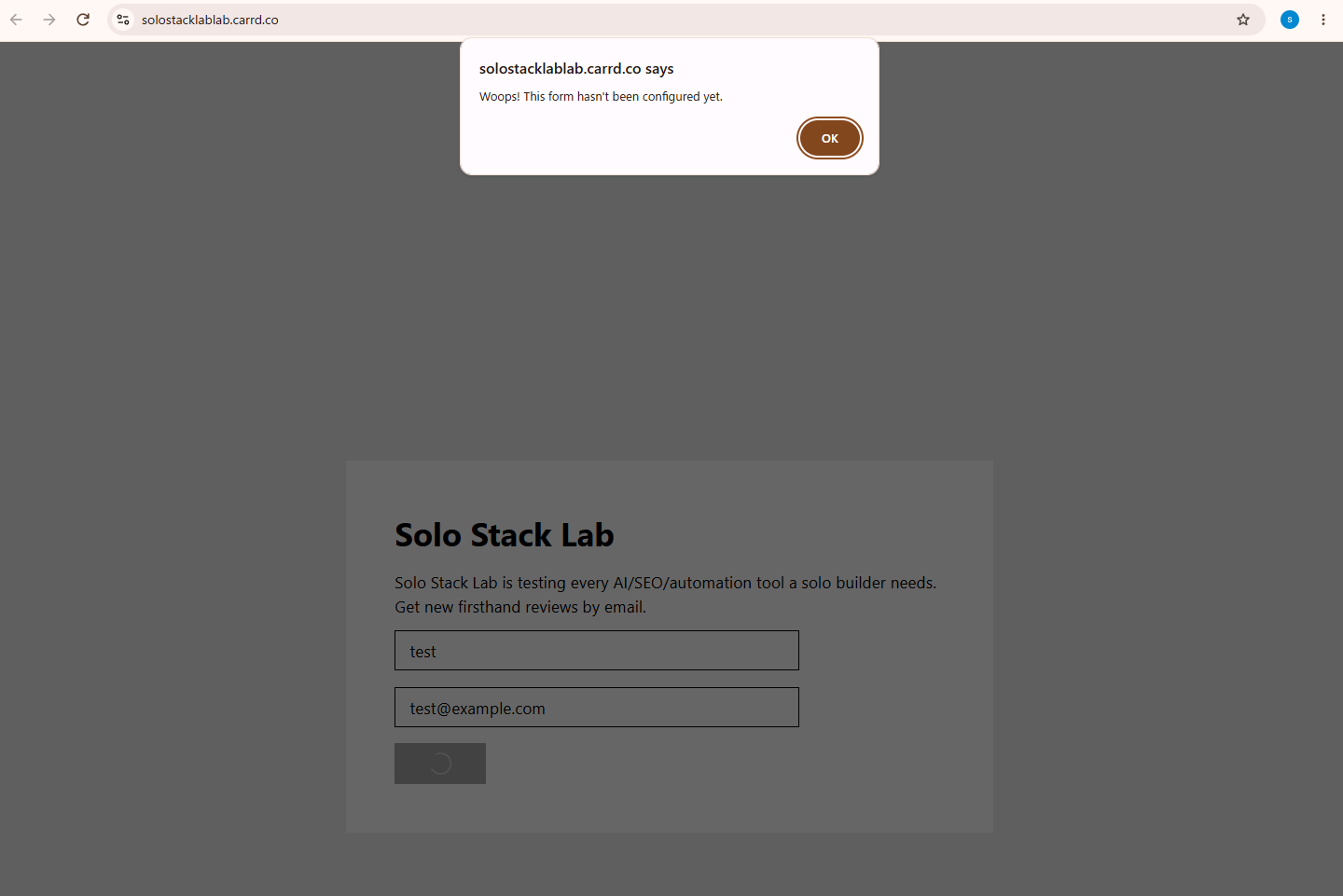 Browser alert on the published Carrd page reading Woops, this form hasn't been configured yet, shown after submitting a test email